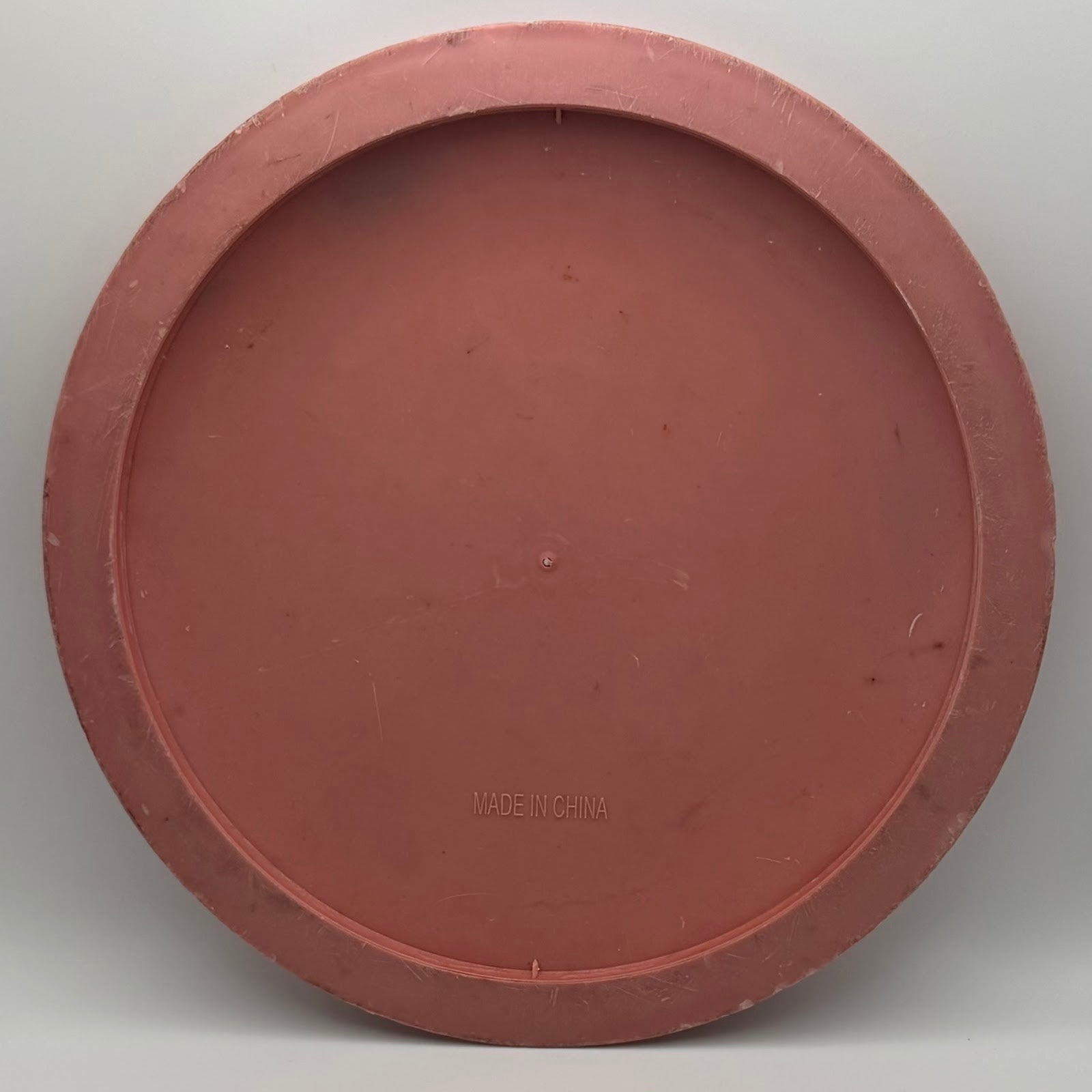 Generic Frisbee pink back showing MADE IN CHINA